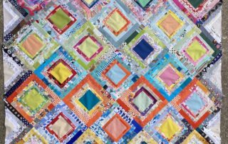 a colourful square quilt