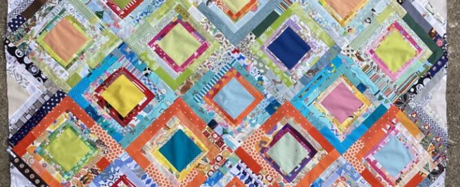 a colourful square quilt