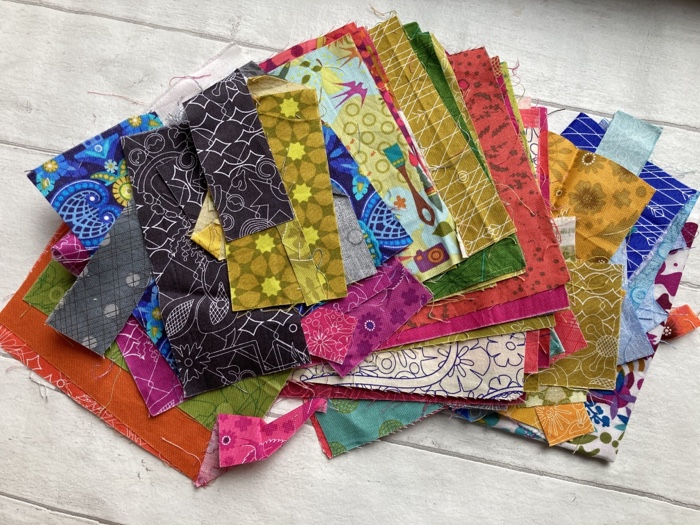 A pile of vibrant Alison Glassfabrics