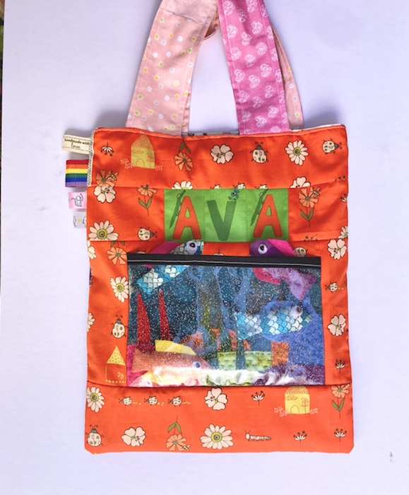 Bright orange Home made Tote bag with a fish tank on the side