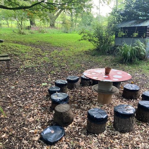 a wooden toadstool table and chairs