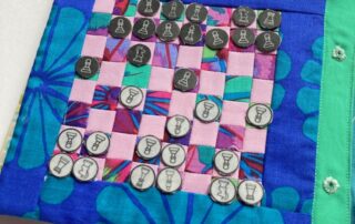 a chess board made in patchwork fabric