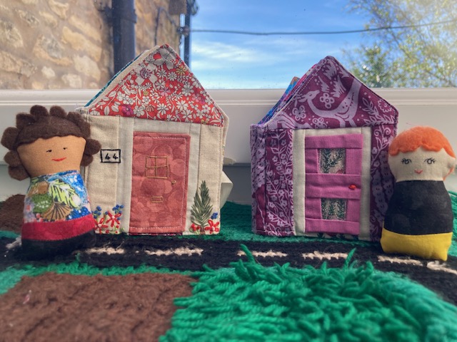 Tiny Town - Mandy and Ella are stood outside their Tiny House Book homes